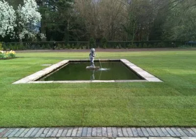 Lawn landscaped with water feature