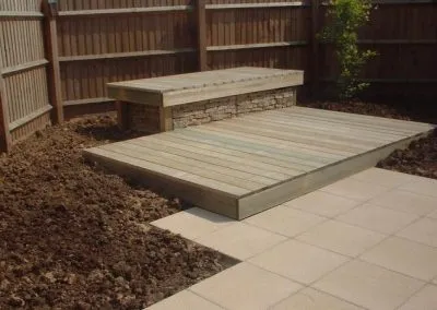 Photo of a landscaped garden wih deck lounger